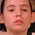 a young teenager takes a bath